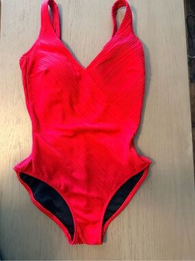 Red. Luxury one-piece swimsuit. Size 6. Excellent condition.